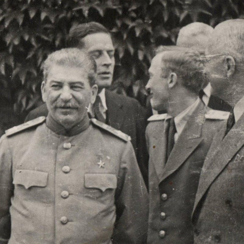 Photo of I.V. Stalin surrounded by Soviet and foreign military and diplomats